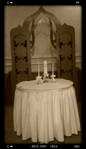 It was a steampunk wedding, therefore daguerreotypes. The wedding set up with the arch. Photo by James Sheridan.