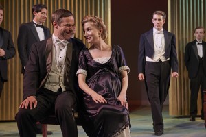 Polixenes (Josh Carpenter) confers with Hermione (Nisi Sturgis) while jealous Leontes (Jordan Coughtry) observes.